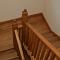 Oak cut string staircase with finials (view1)